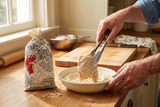 Coating chicken with Yard Bird Batta mix in a home kitchen.